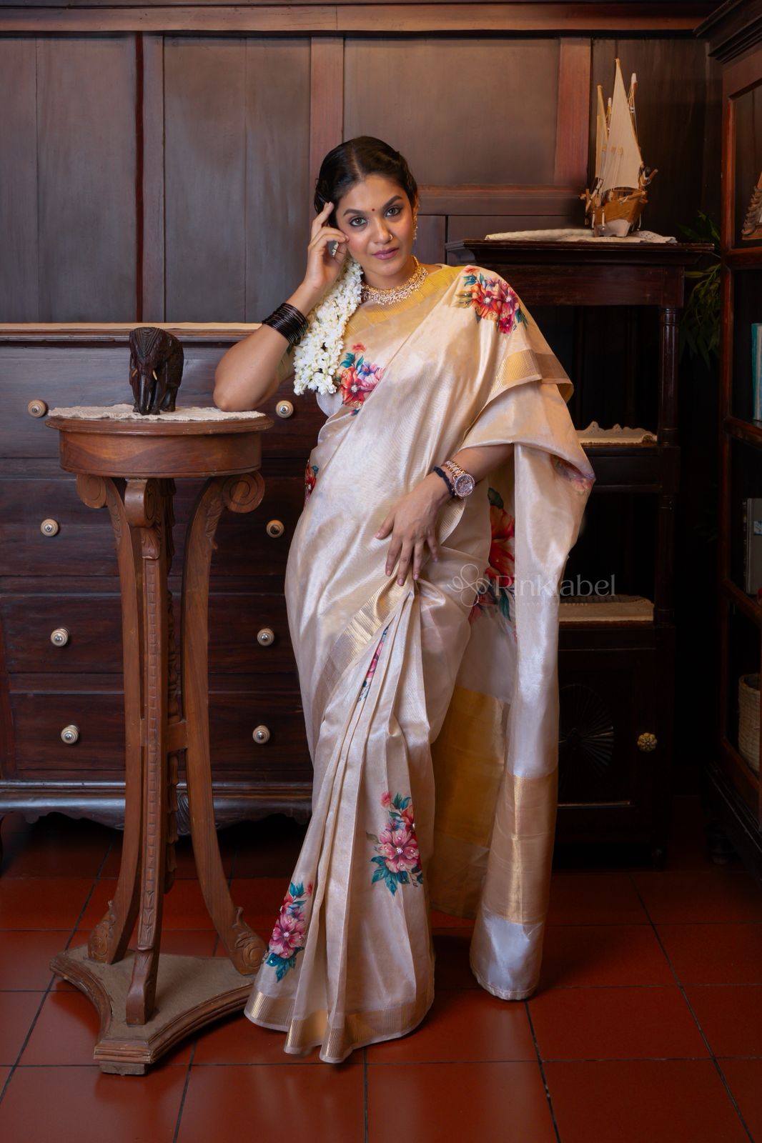 Golden saree with flower design and hand work