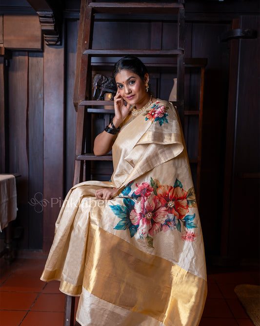 Golden saree with flower design and hand work