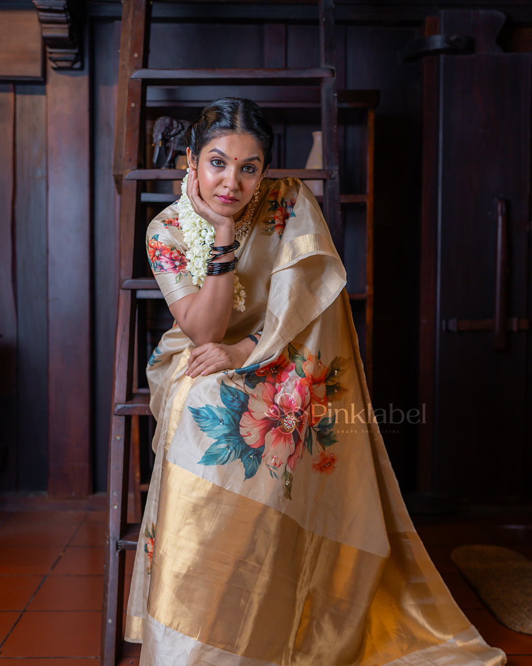 Golden saree with flower design and hand work