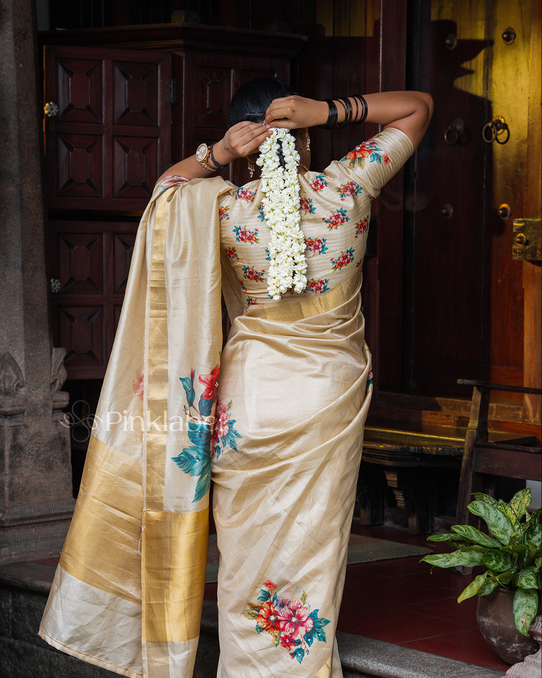 Golden saree with flower design and hand work